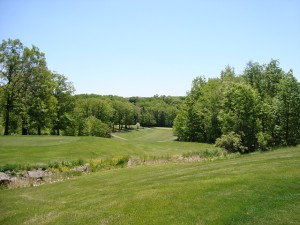 The dogleg right of the old reservoir hole can be seen as an indentation on the right side of the fairway about 150 yards out.